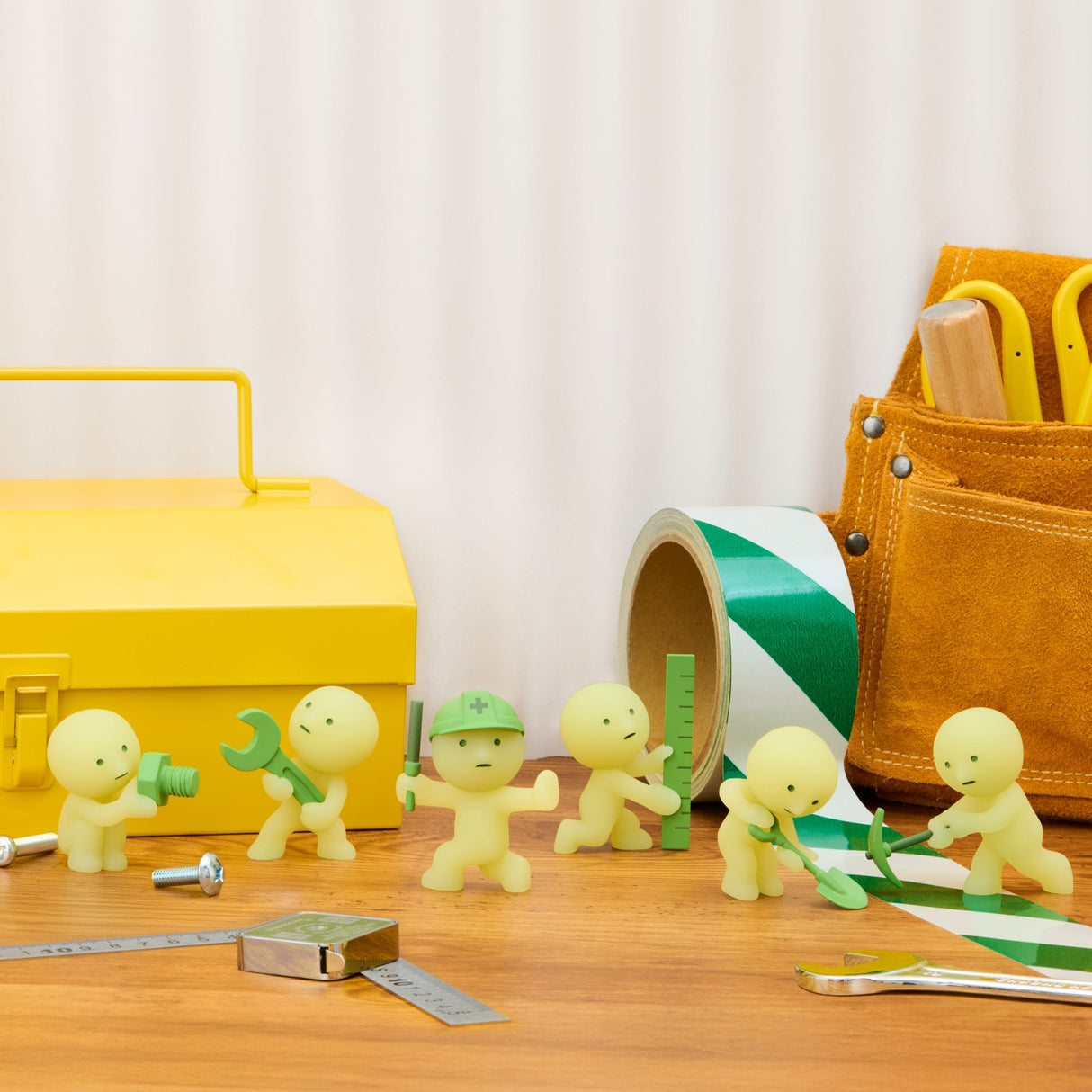 SMISKI Construction Series glow-in-the-dark figure lineup panel